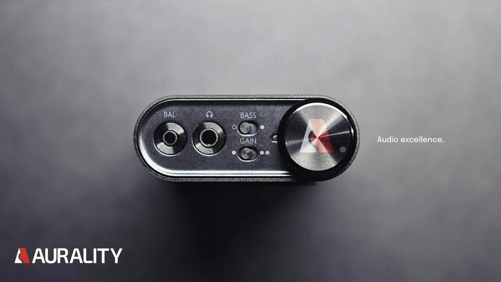 Black Aurality headphone amp with a red-center volume dial and the Aurality lockup