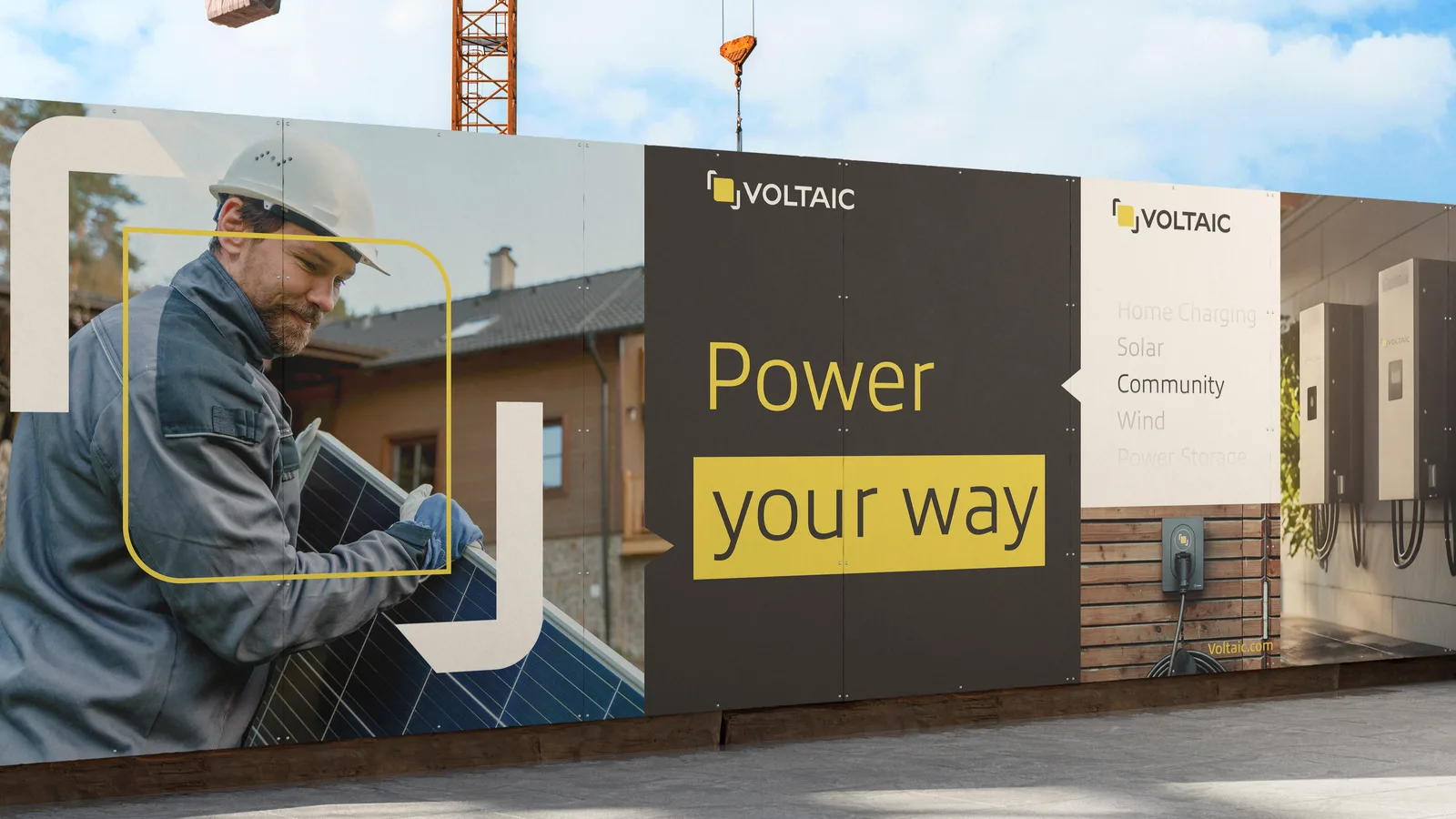 Construction billboard: a worker carrying a solar panel beside a dark Power your way headline panel